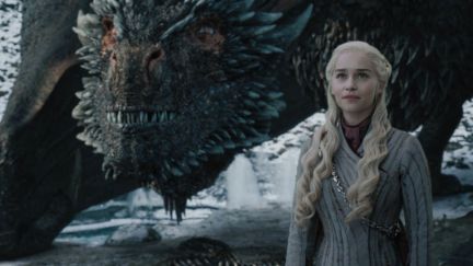 Drogon beside Daenerys Targaryen at the last season of Game of Thrones.