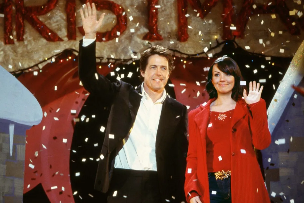 The Prime Minister and Natalie wave at an unexpected crowd in 'Love Actually.'