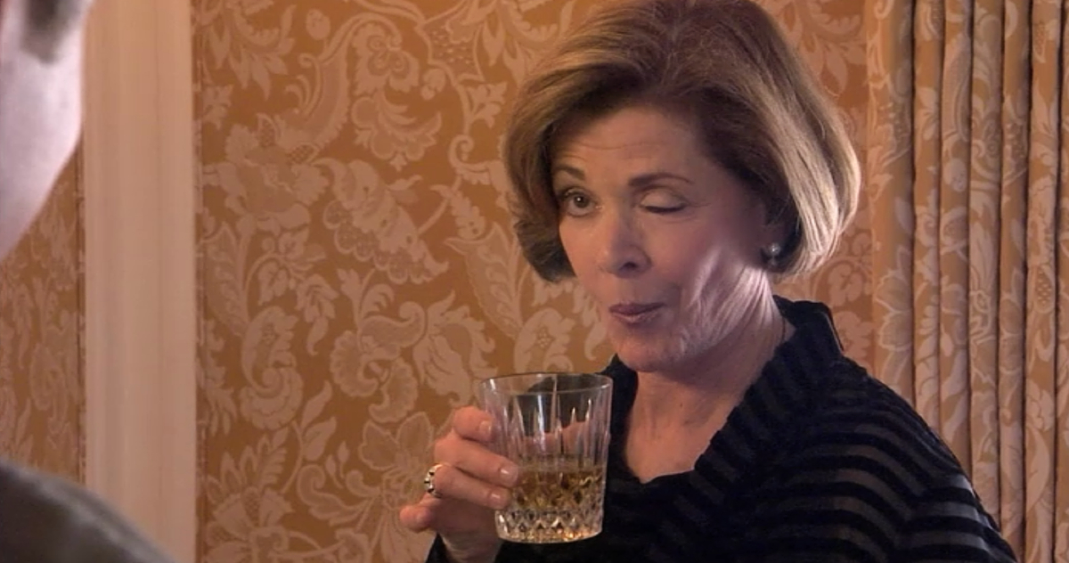Lucille Bluth (Jessica Walter) winks while raising a glass of alcohol in 'Arrested Development.'