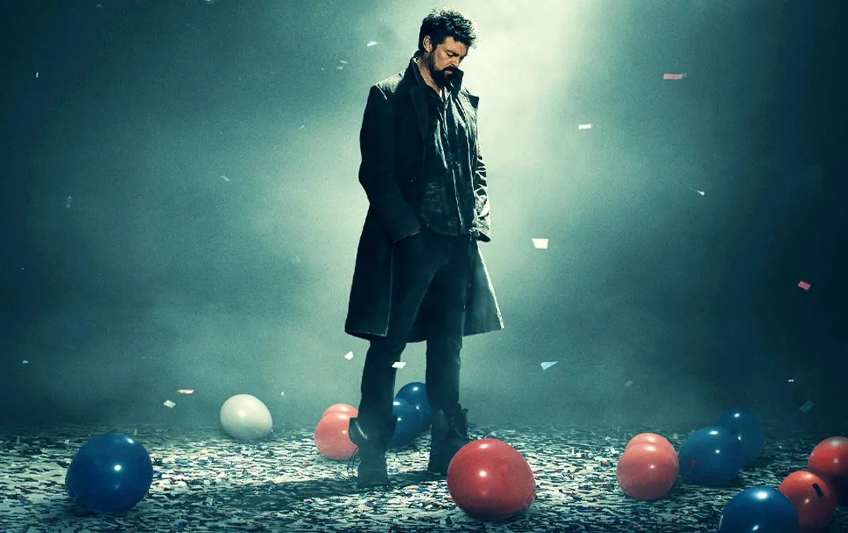 A man walks in a room with balloons and confetti on the floor in 'The Boys' promo image.