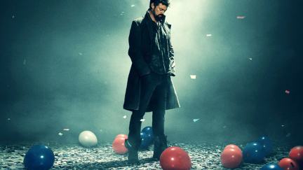 A man walks in a room with balloons and confetti on the floor in 'The Boys' promo image.