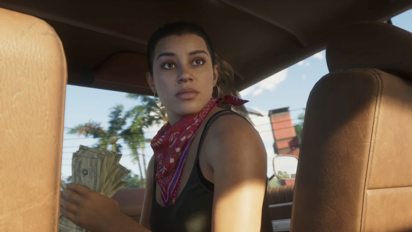Lucia in Grand Theft Auto VI trailer holding money in a car.