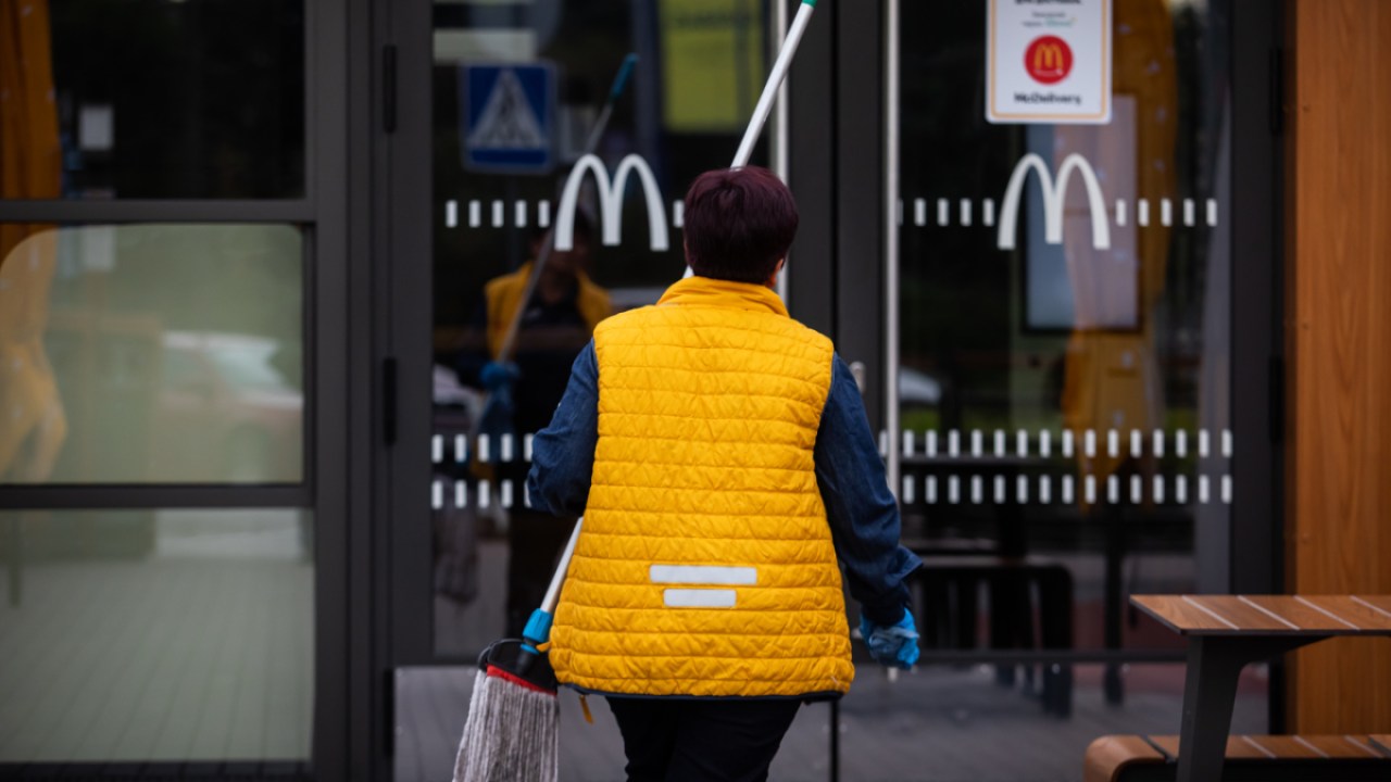 A woman walking into McDonald's. Photo by Yevhenii Zavhorodnii/Global Images Ukraine via Getty Images