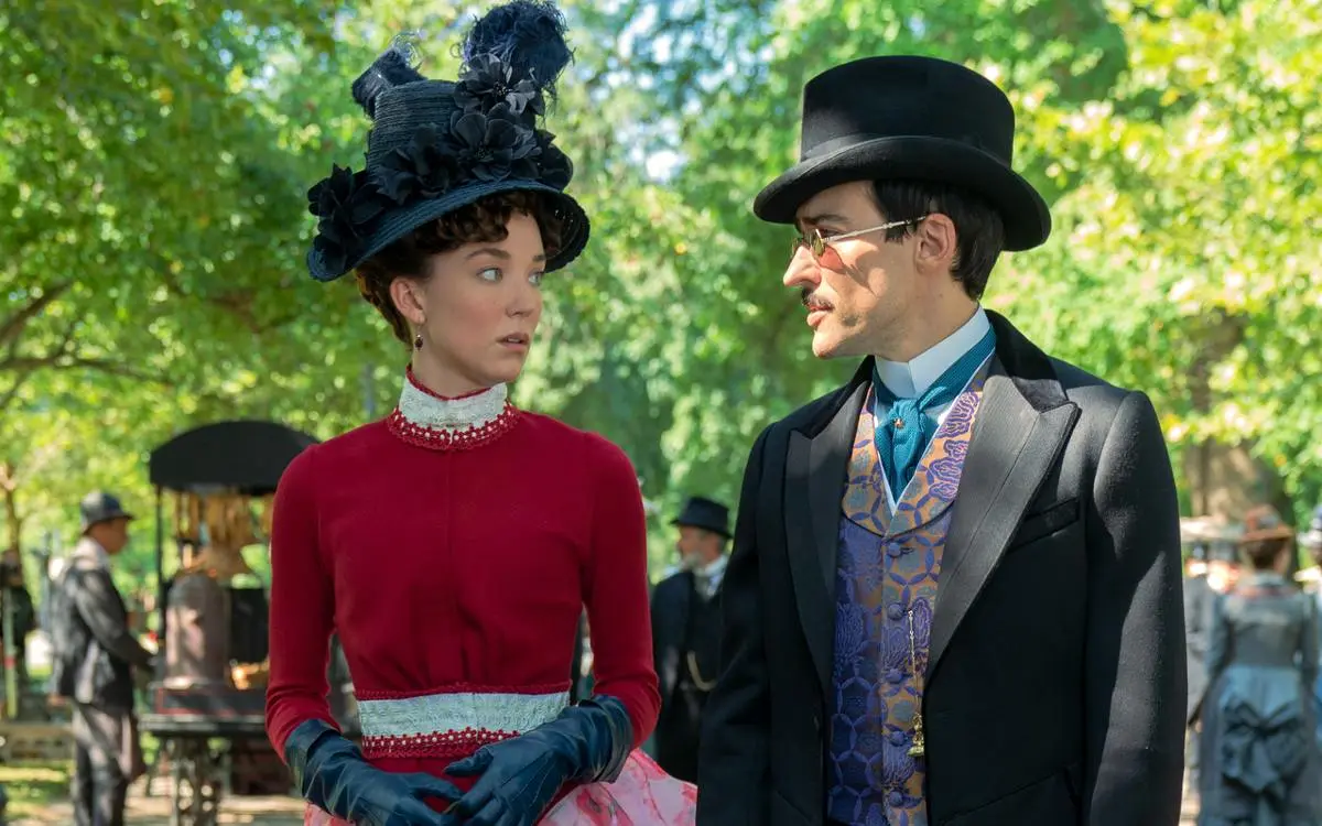 Maud Beaton (Nicole Brydon Bloom) and Oscar van Rhijn (Blake Ritson) walking in the park in 'The Gilded Age.'
