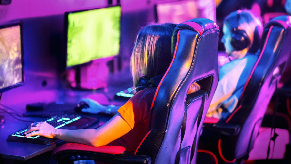 Woman playing a video game at a PC LAN cafe