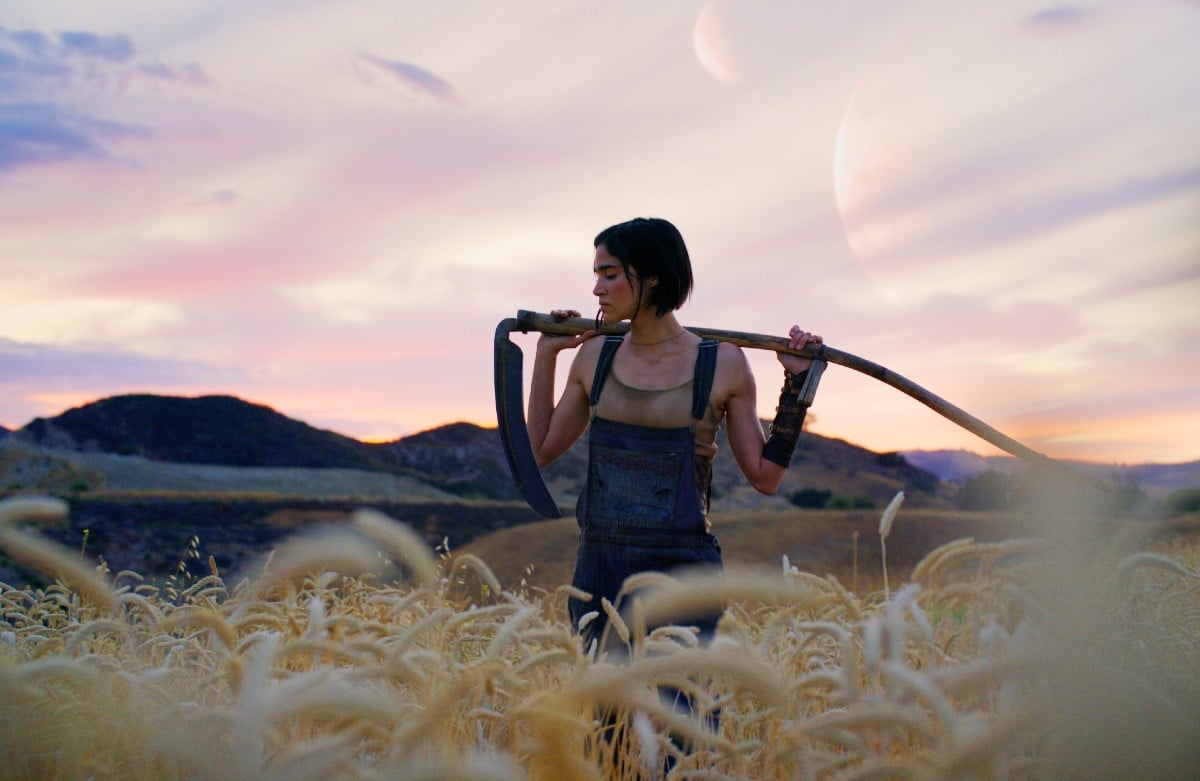 Kora stands in a field in 'Rebel Moon Part One: A Child of Fire.'