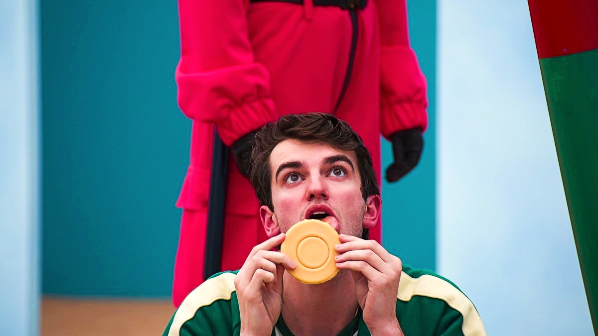 A contestant during the honeycomb candy challenge in Squid Game: The Challenge