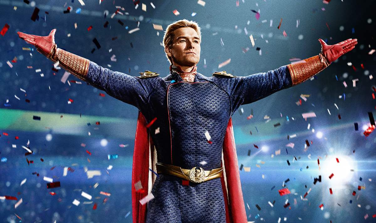 A white male superhero stands with his arms spread as confetti rains down in 'The Boys.'