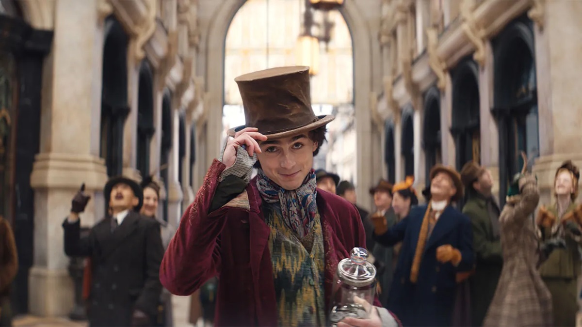 Timothee Chalamet tips his hat as Wonka