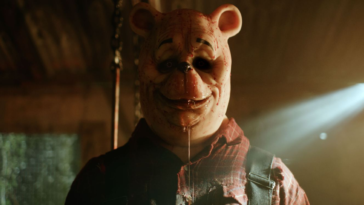 A man in a scary Winnie-the-Pooh mask in 'Winnie the Pooh: Blood and Honey'