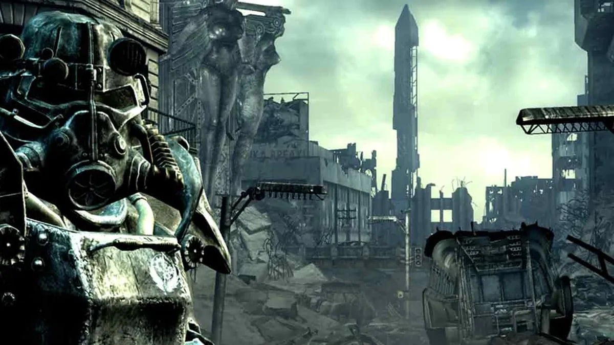 A person in a suit of robotic armor stares into the camera in a ruined city in "Fallout 3"
