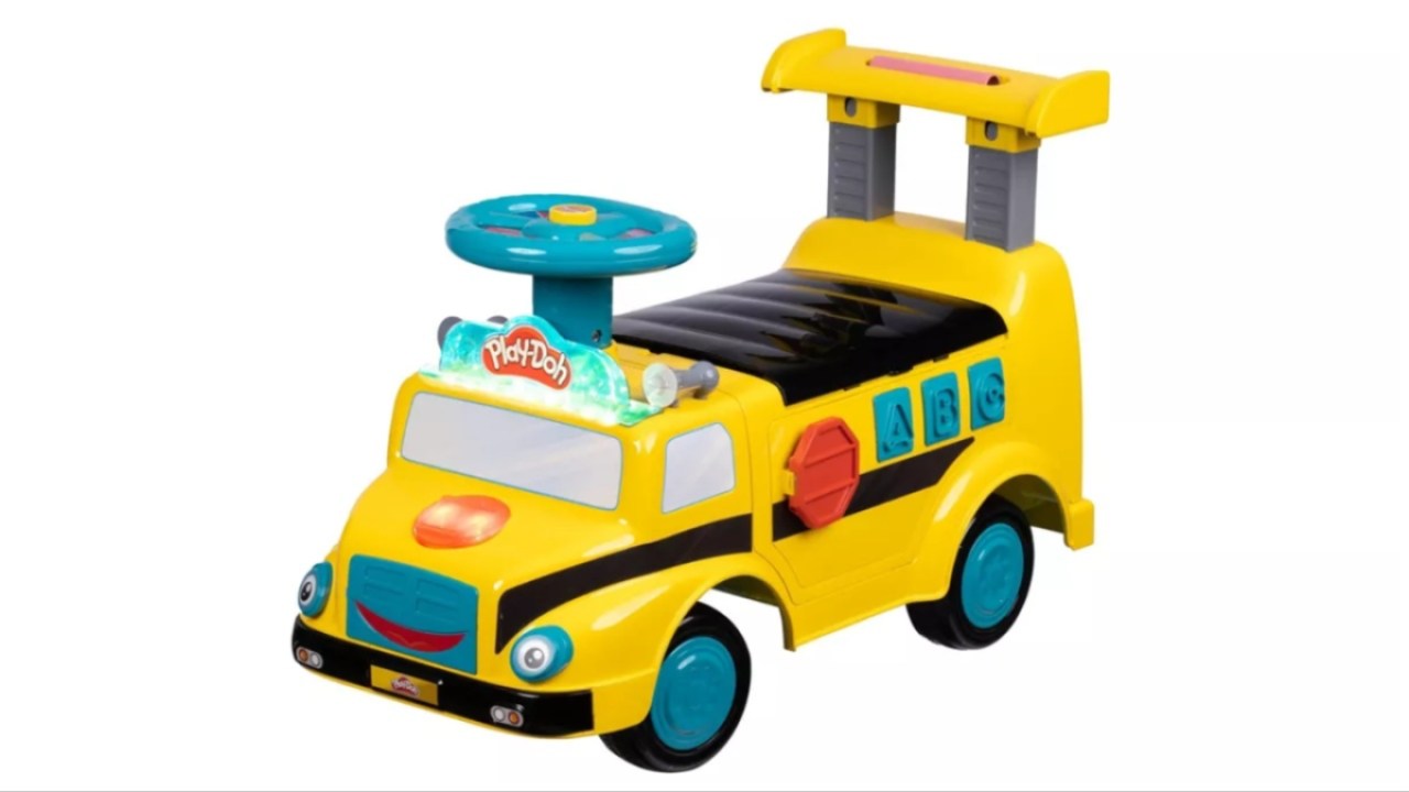 A ride-on toy school bus that holds Play Doh and cutters. 