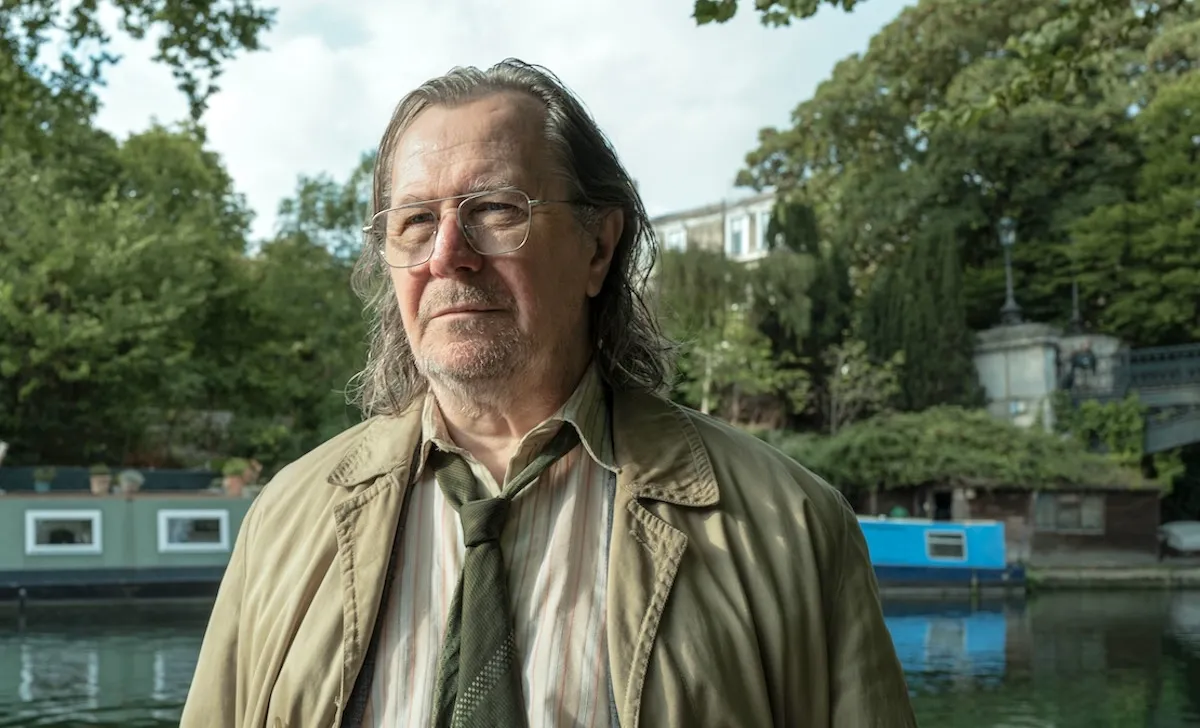 Gary Oldman as Jackson Lamb stands in front of a London canal in 'Slow Horses'