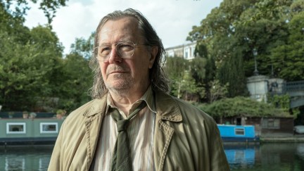 Gary Oldman as Jackson Lamb stands in front of a London canal in 'Slow Horses'