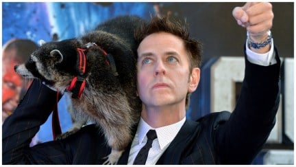 James Gunn walks the red carpet with a live raccoon on his shoulder.