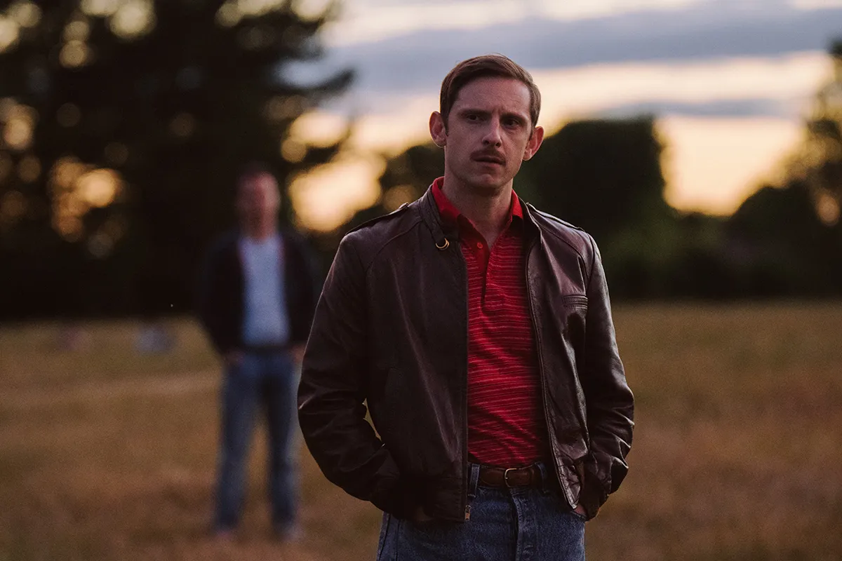 Dad (Jamie Bell) standing in a field seeing Adam for the first time