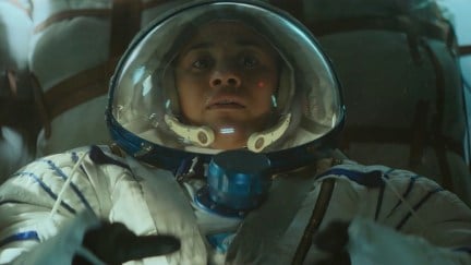 Kira (Ariana DeBose) looking frightened in a pressure suit in I.S.S.
