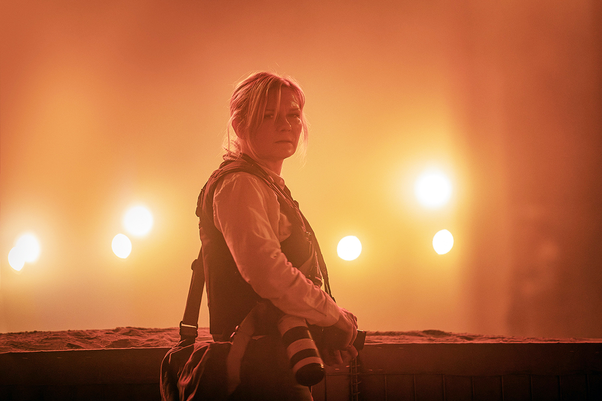 Kirsten Dunst poses in red dust at Alex Garland