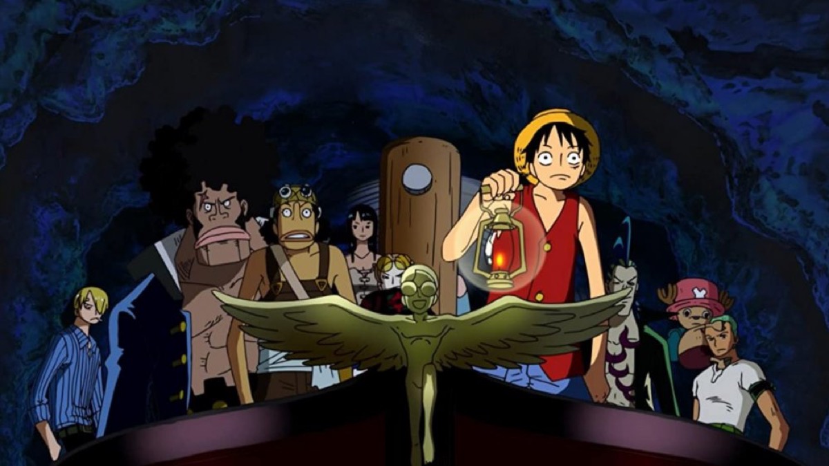 A group of pirates explore a dark cavern in "One Piece: The Giant Mechanical Soldier of Karakuri Castle" 