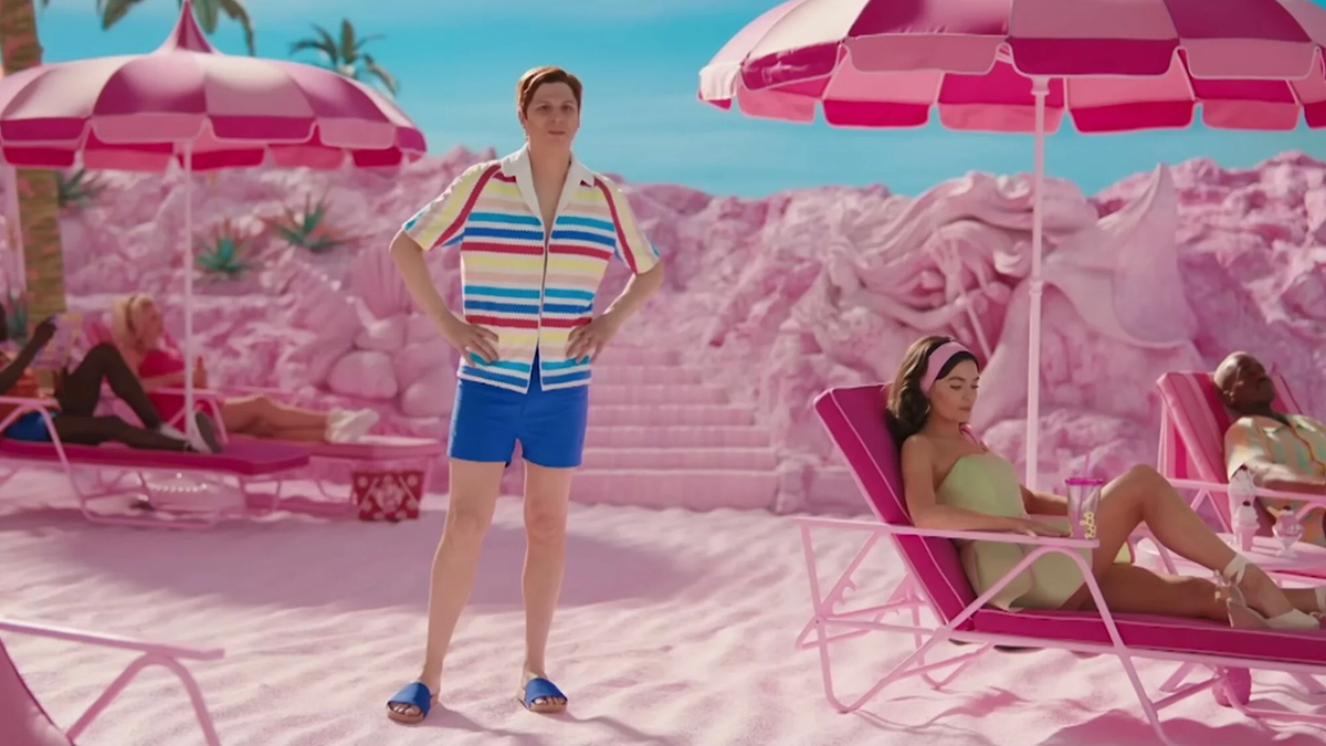 Michael Cera as Allan standing on a beach in Barbie