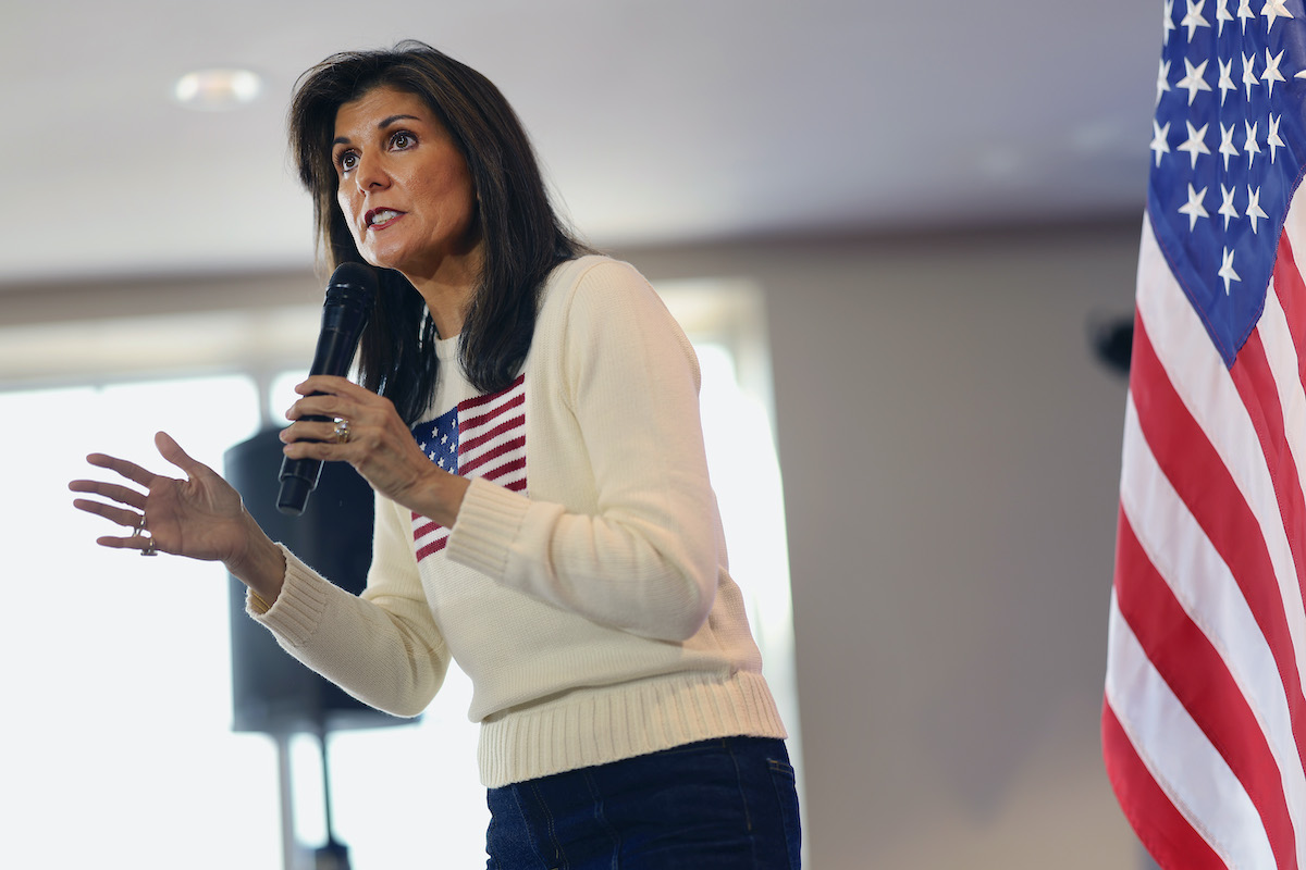 Nikki Haley speaks into a microphone during a town hall event.