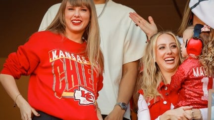Taylor Swift smiles while watching a football game.