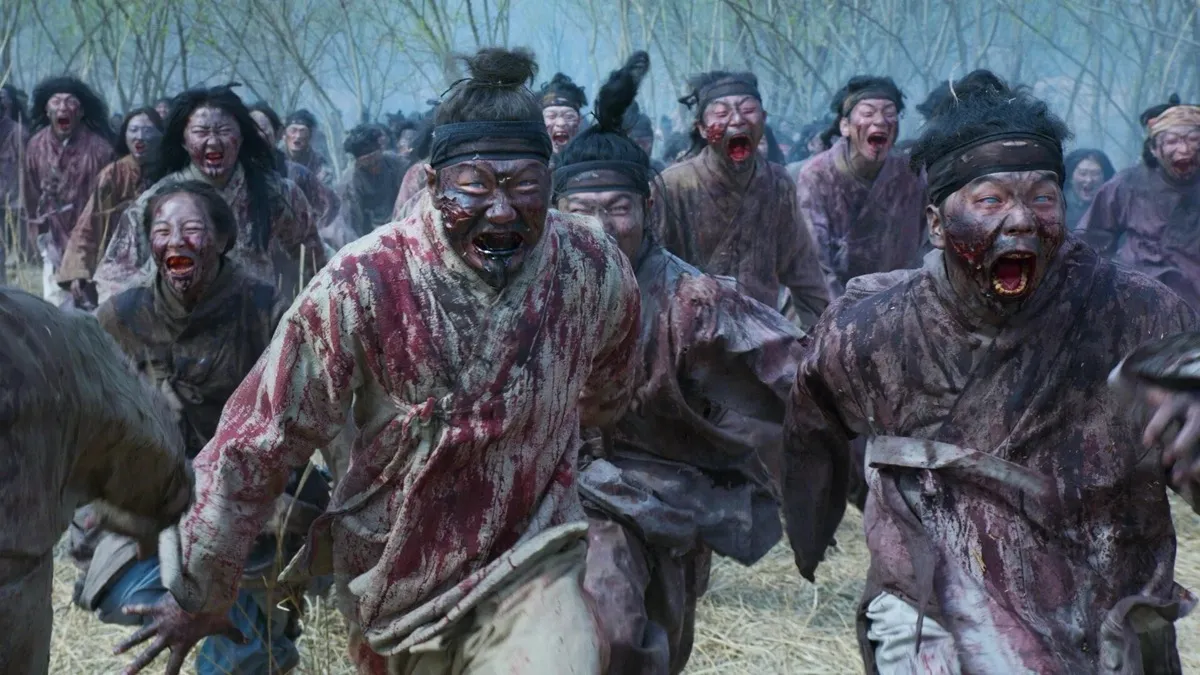 A horde of zombies running in the woods in "The Kingdom"