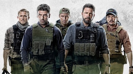 Charlie Hunnam, Oscar Isaac, Garrett Hedlund, Ben Affleck, and Pedro Pascal all walking on a poster for Triple Frontier