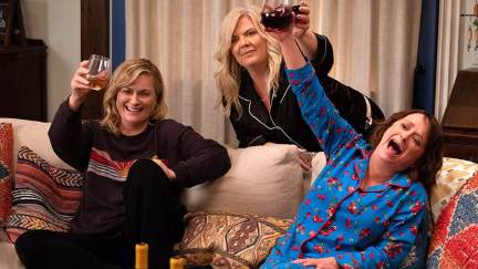 Three friends laugh and raise their wine glasses in 'Wine Country.'