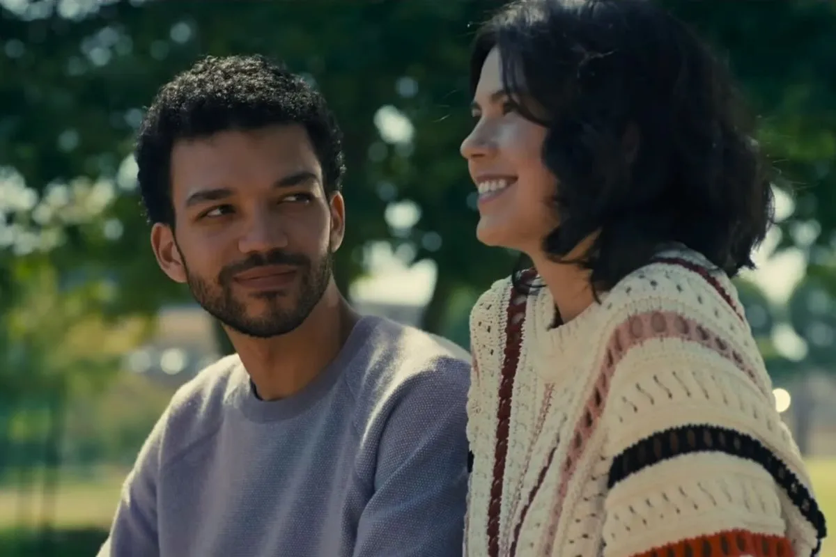 Aren (Justice Smith) looking at An-Li Bogan's character in 'American Society of Magical Negroes.'