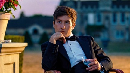 Oliver (Barry Keoghan) drinks and plots in 'Saltburn.'