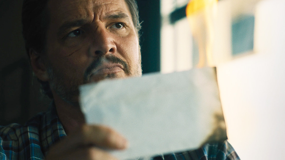 Pedro Pascal holding up a piece of paper in 'Freaky Tales'