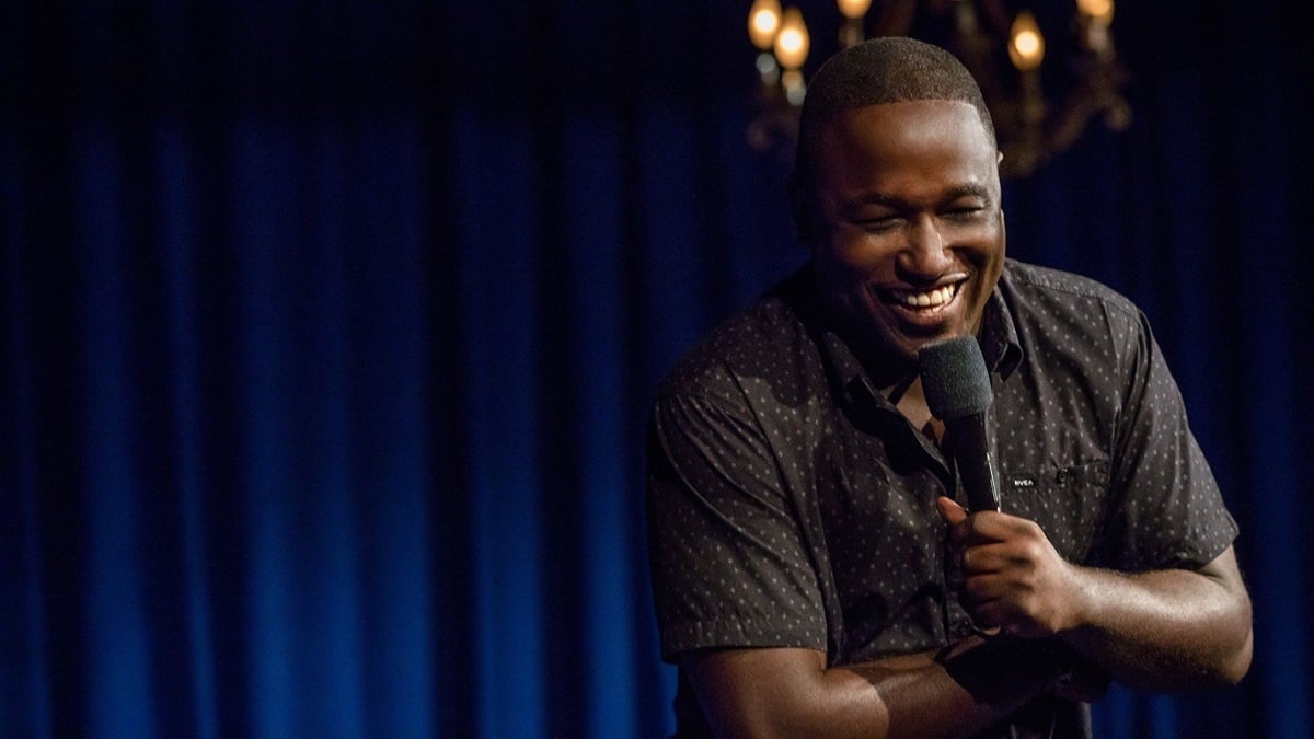 Hannibal Buress laughing while on stage