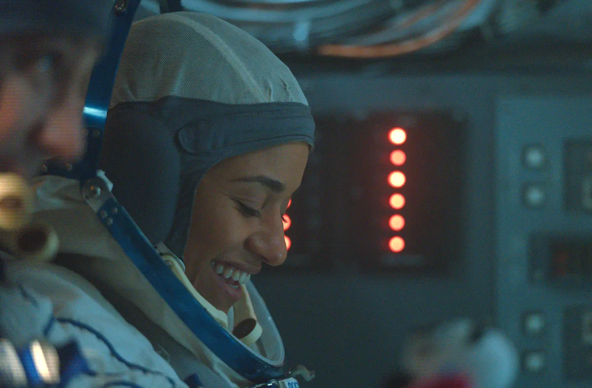 Ariana DeBose as Kira Foster, wearing a pressure suit in I.S.S.