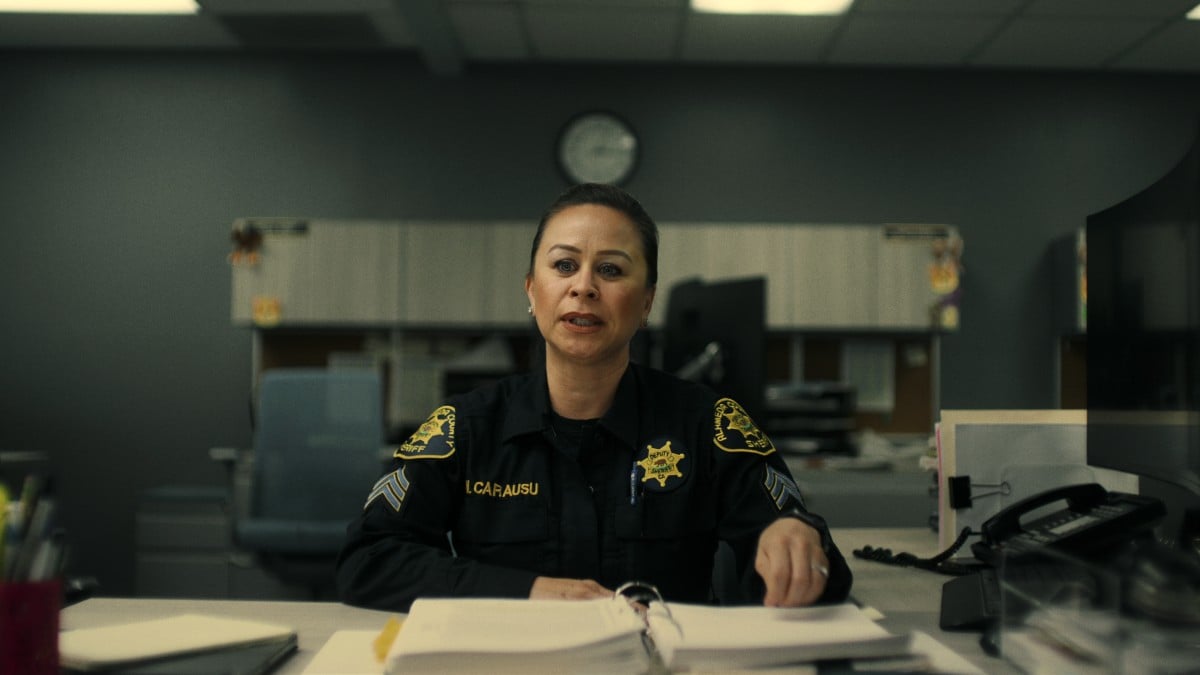 Officer Misty Carausu sits behind a desk in 'American Nightmare.'