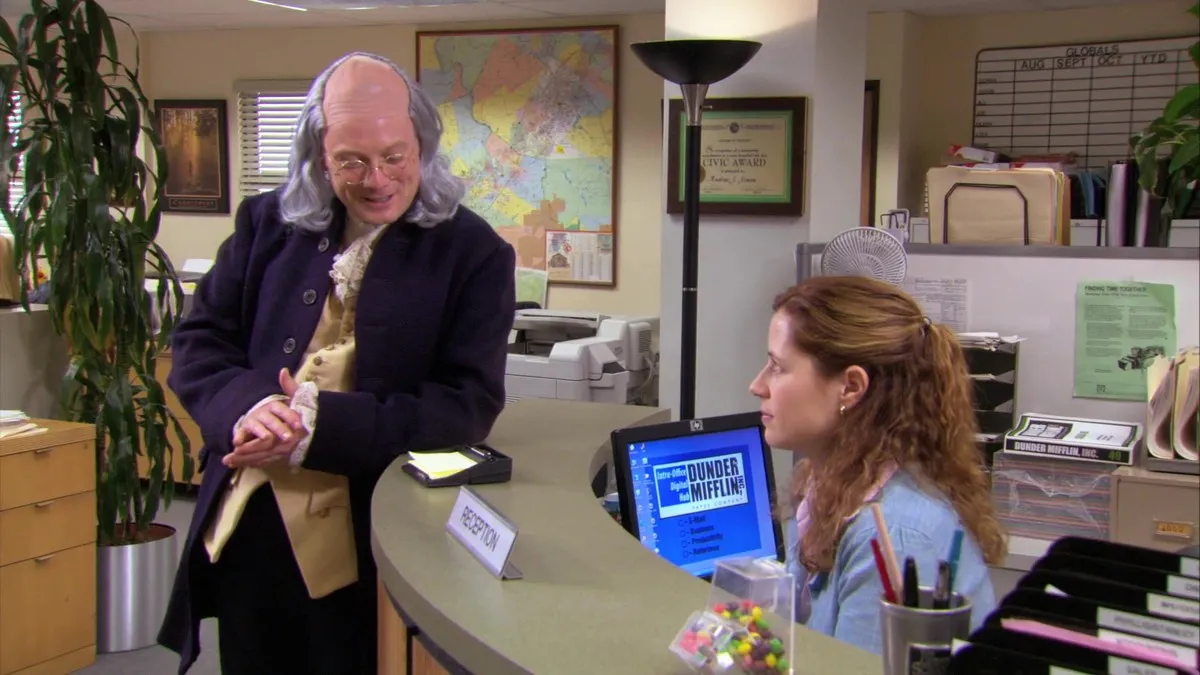 Ben Franklin impersonator (Andy Daly) chats up Pam (Jenna Fischer) on The Office