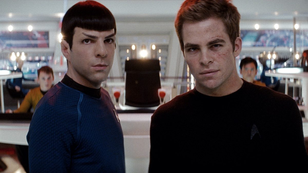 chris pine and zachary quinto standing next to each other in star trek