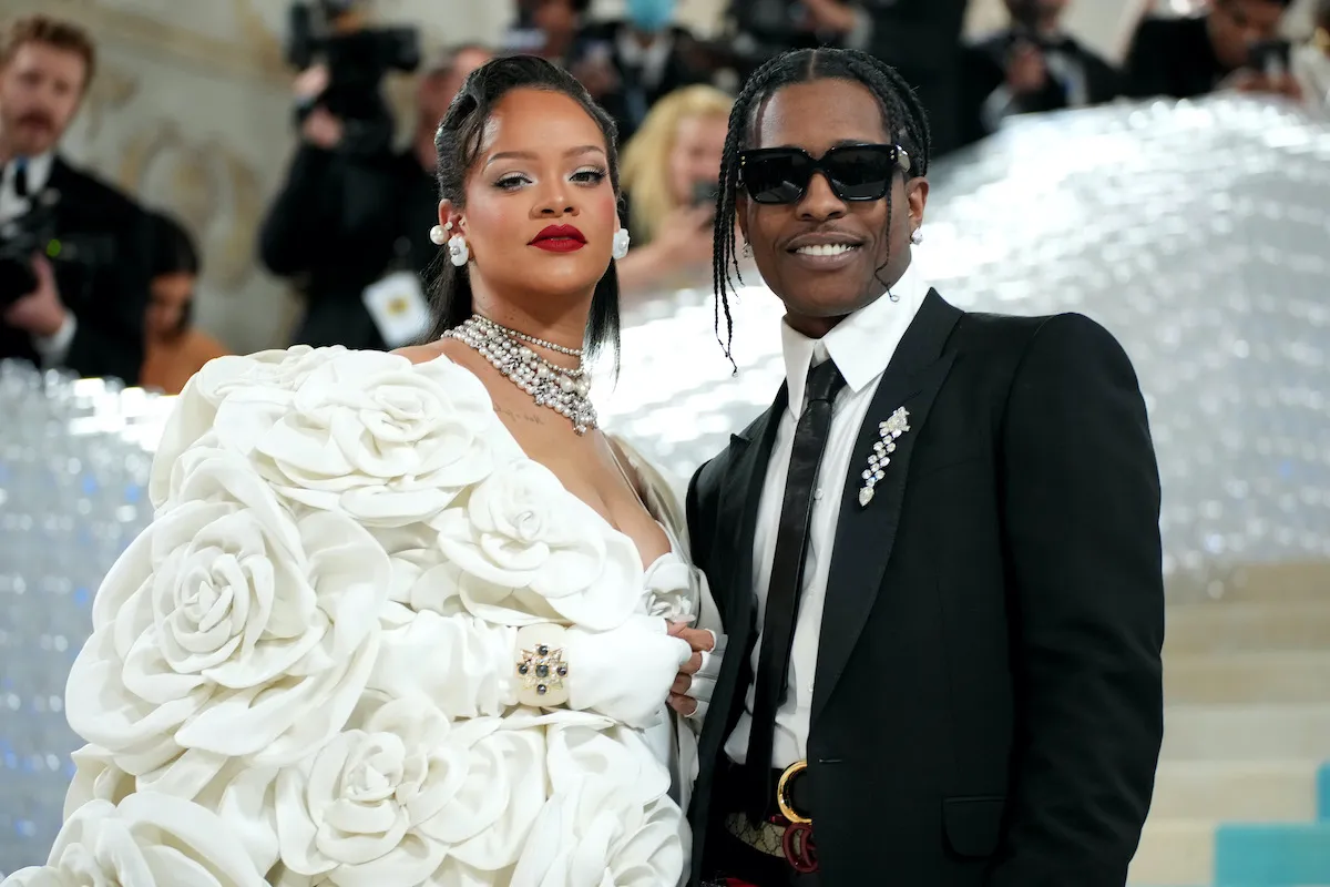 Rihanna and A$AP Rocky smile into the camera at the MET Gala