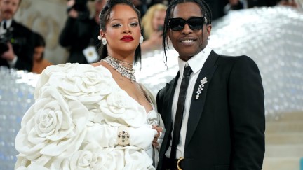 Rihanna and A$AP Rocky smile into the camera at the MET Gala