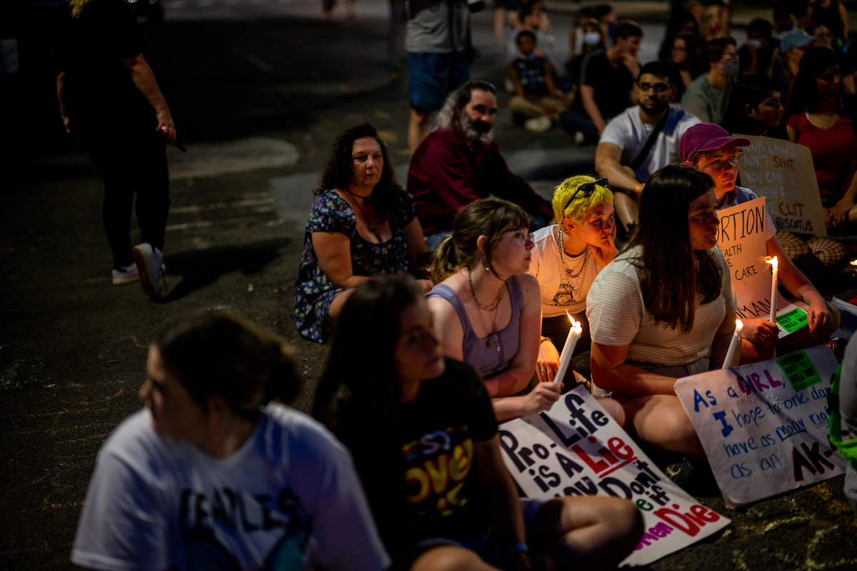 Protesters attend a candlelight vigil for abortion rights.