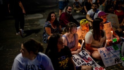 Protesters attend a candlelight vigil for abortion rights.