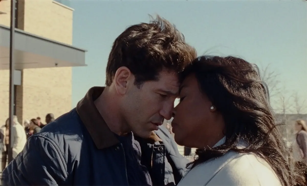 Jon Bernthal and Aunjanue Ellis-Taylor touching foreheads, looking at each other