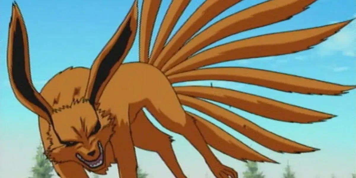 A nine tailed fox monsters stands above the trees in "Naruto"