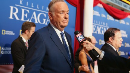 Bill O'Reilly talks to a reporter at an event.