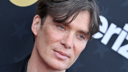 A close-up of Cillian Murphy's face on a red carpet.