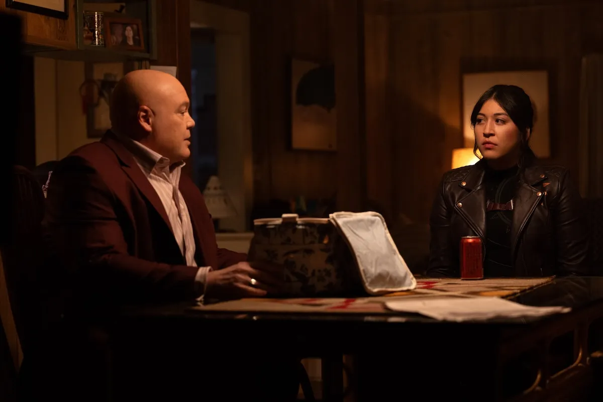 Maya Lopez sitting at a table with Kingpin for their family dinner