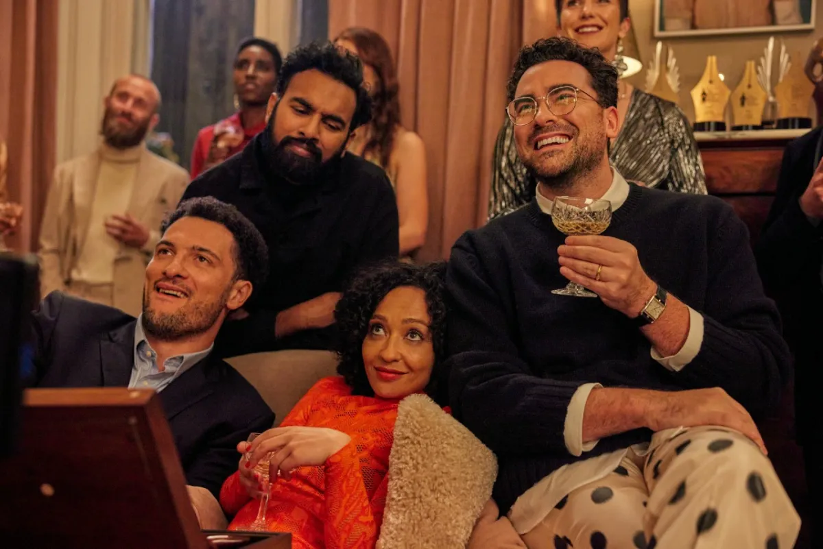 A group of friends (Ruth Negga, Himesh Patel, Dan Levy) sit together on a couch in 'Good Grief.'