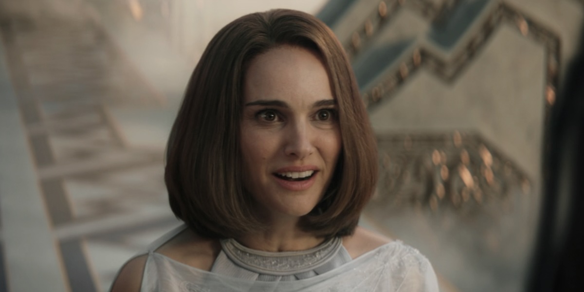 Jane smiles, standing at the gate of Valhalla in Thor: Love and Thunder.