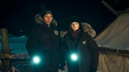 Kali Reis and Jodie Foster standing with their flashlights in True Detective: Night Country