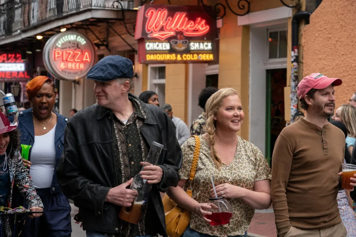 Michael Rapaport, Amy Schumer, and Michael Cera walk in the French Quarter in New Orleans in Hulu's 'Life and Beth'.